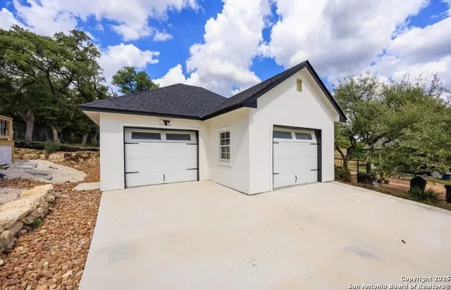 a view of white house with a outdoor space