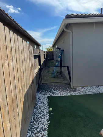a kitchen with stainless steel appliances granite countertop a table chairs sink and cabinets