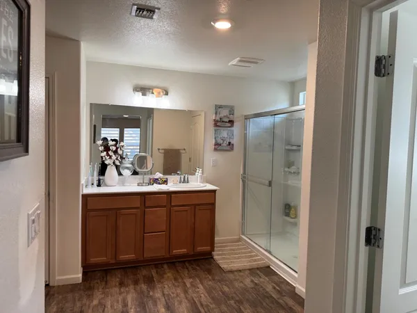 a white toilet sitting next to a bathroom sink