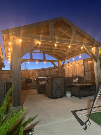 a close view of light fixtures and toilet in a bathroom