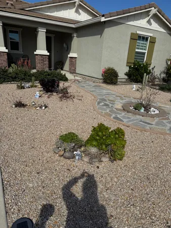 a front view of a house with garden