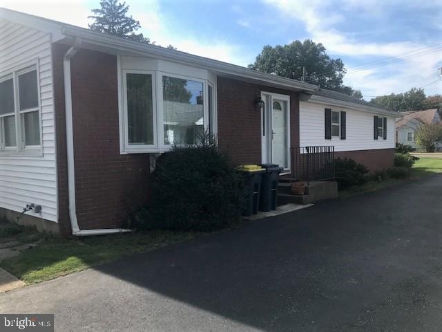2602-2604 Ebright Road Wilmington, DE 19810 - Photo 11 of 16 a front view of a house with garden