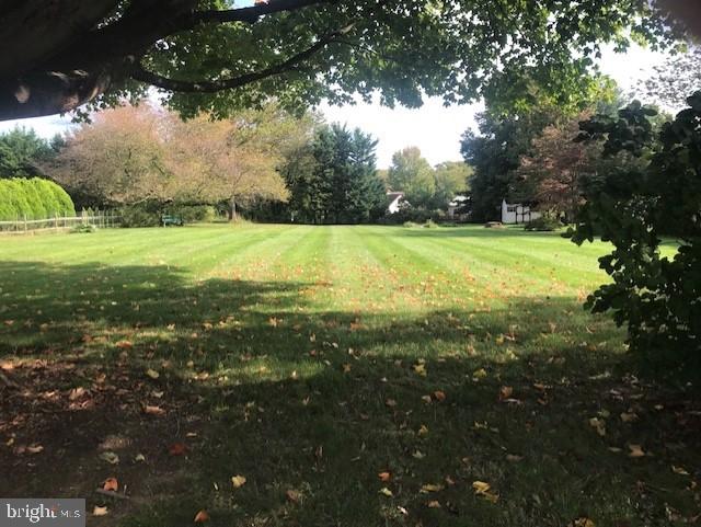 2602-2604 Ebright Road Wilmington, DE 19810 - Photo 16 of 16 a view of outdoor space with deck and trees