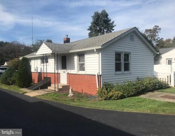 2602-2604 Ebright Road Wilmington, DE 19810 - Photo 5 of 16 a front view of a house with a yard and garage