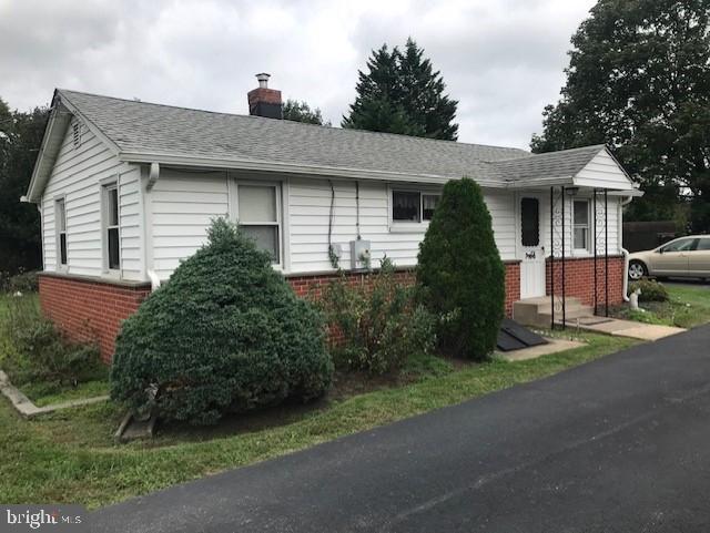 2602-2604 Ebright Road Wilmington, DE 19810 - Photo 6 of 16 a front view of a house with a garden