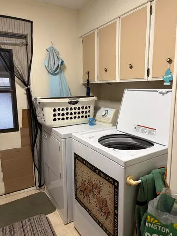 a kitchen with a stove and white cabinets