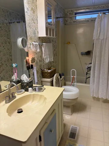 a bathroom with a sink and mirror