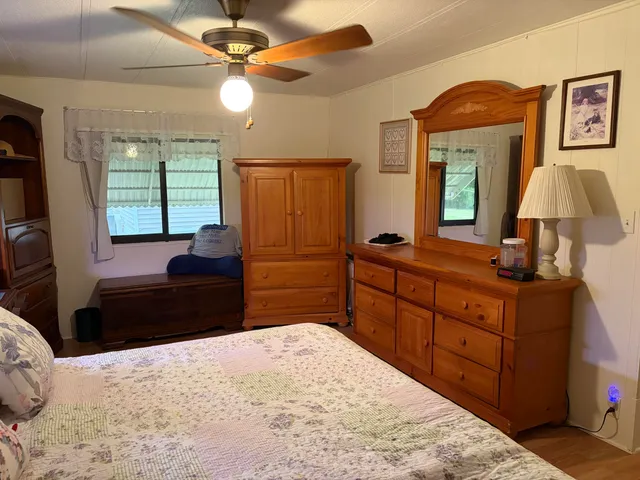 a bedroom with a bed and a dresser