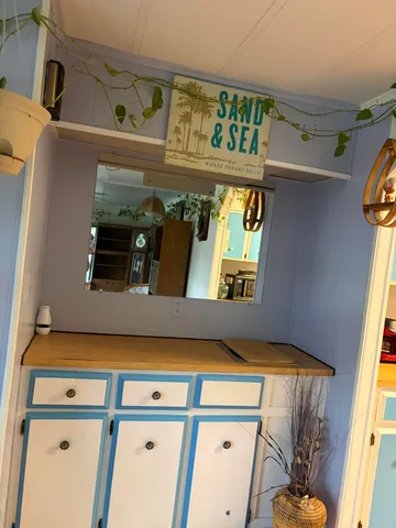 a living room with furniture and a rug