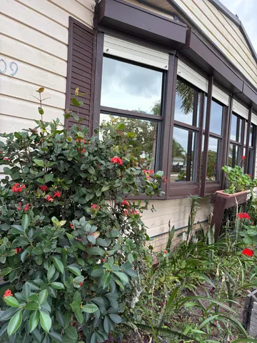 a view of a building with a flower garden