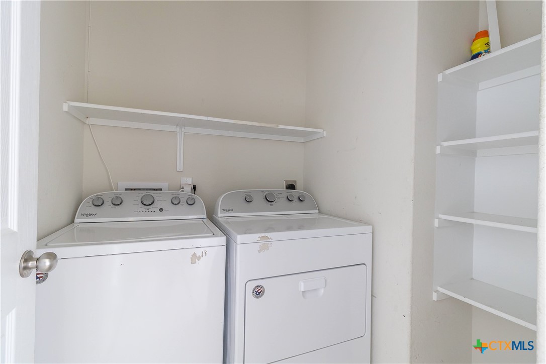 145 Miracle Drive Jarrell, TX 76537 - Photo 12 of 23 a utility room with dryer and washer