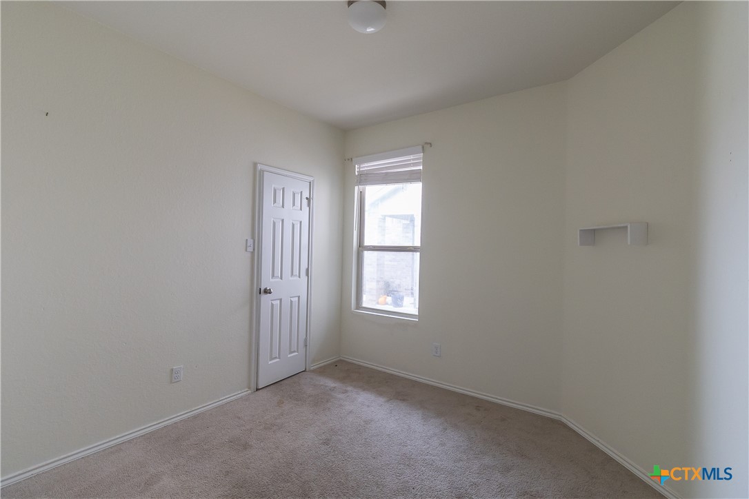 145 Miracle Drive Jarrell, TX 76537 - Photo 14 of 23 an empty room with windows