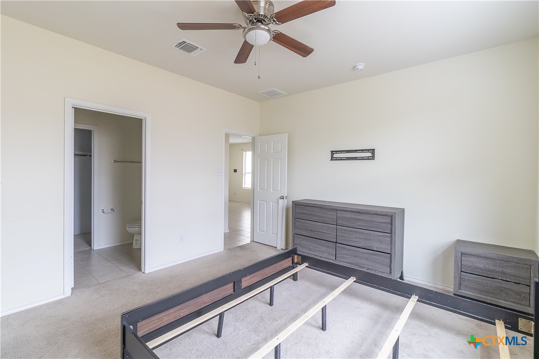 145 Miracle Drive Jarrell, TX 76537 - Photo 18 of 23 a room with furniture and a ceiling fan