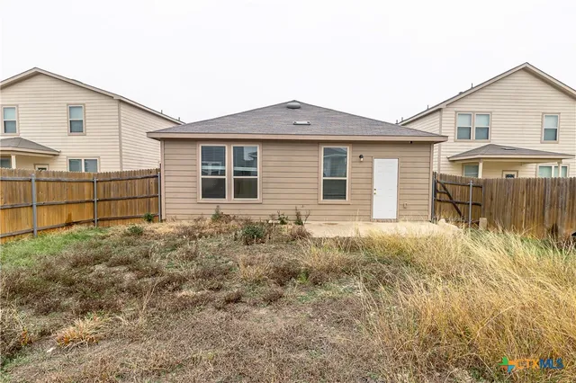 a view of a lake with a building in the background