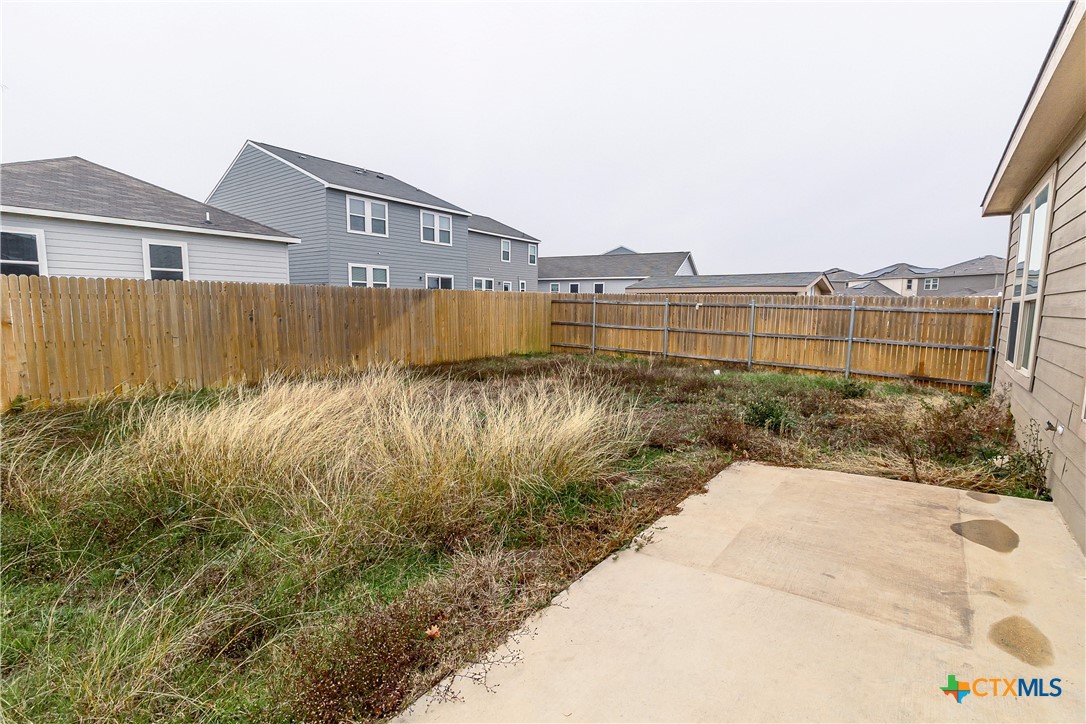 145 Miracle Drive Jarrell, TX 76537 - Photo 23 of 23 a view of a lake with a building in the background