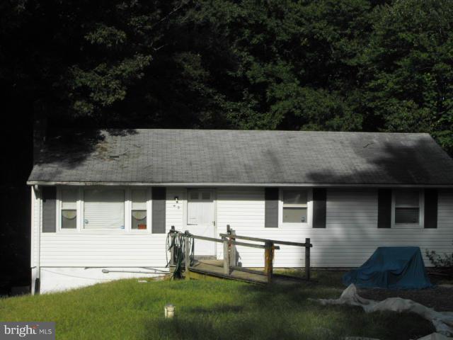245 Tate Road Prince Frederick, MD 20678 - Photo 1 of 15 a backyard of a house with barbeque oven and outdoor seating