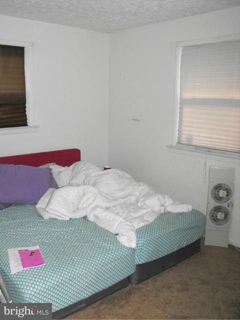 245 Tate Road Prince Frederick, MD 20678 - Photo 11 of 15 a bedroom with a bed and a window