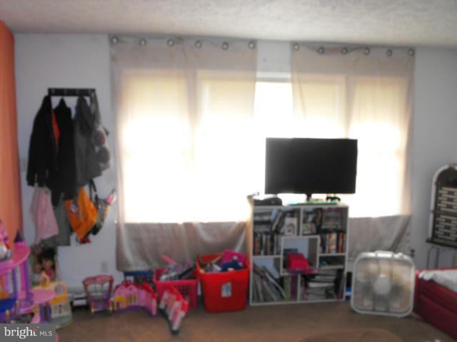 245 Tate Road Prince Frederick, MD 20678 - Photo 3 of 15 a living room with furniture and a flat screen tv