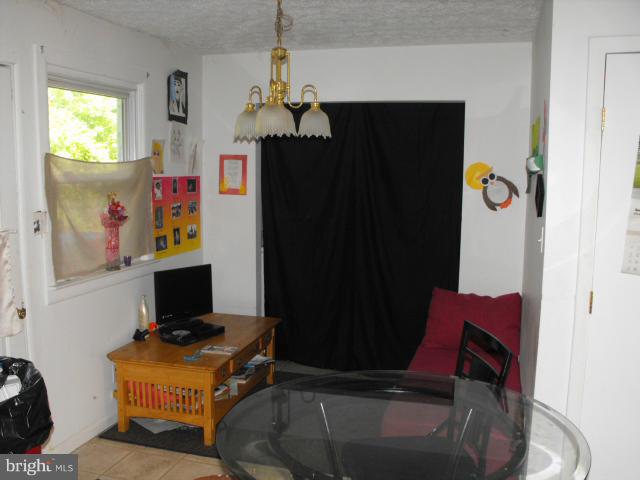 245 Tate Road Prince Frederick, MD 20678 - Photo 6 of 15 a living room with furniture and a flat screen tv