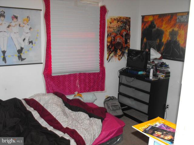 245 Tate Road Prince Frederick, MD 20678 - Photo 7 of 15 a bedroom with a bed and a painting on the wall