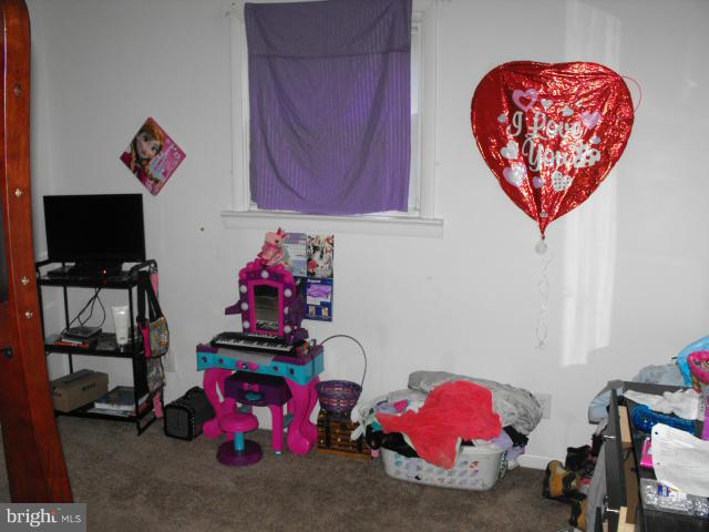 245 Tate Road Prince Frederick, MD 20678 - Photo 10 of 15 a room with toys and a flat screen tv