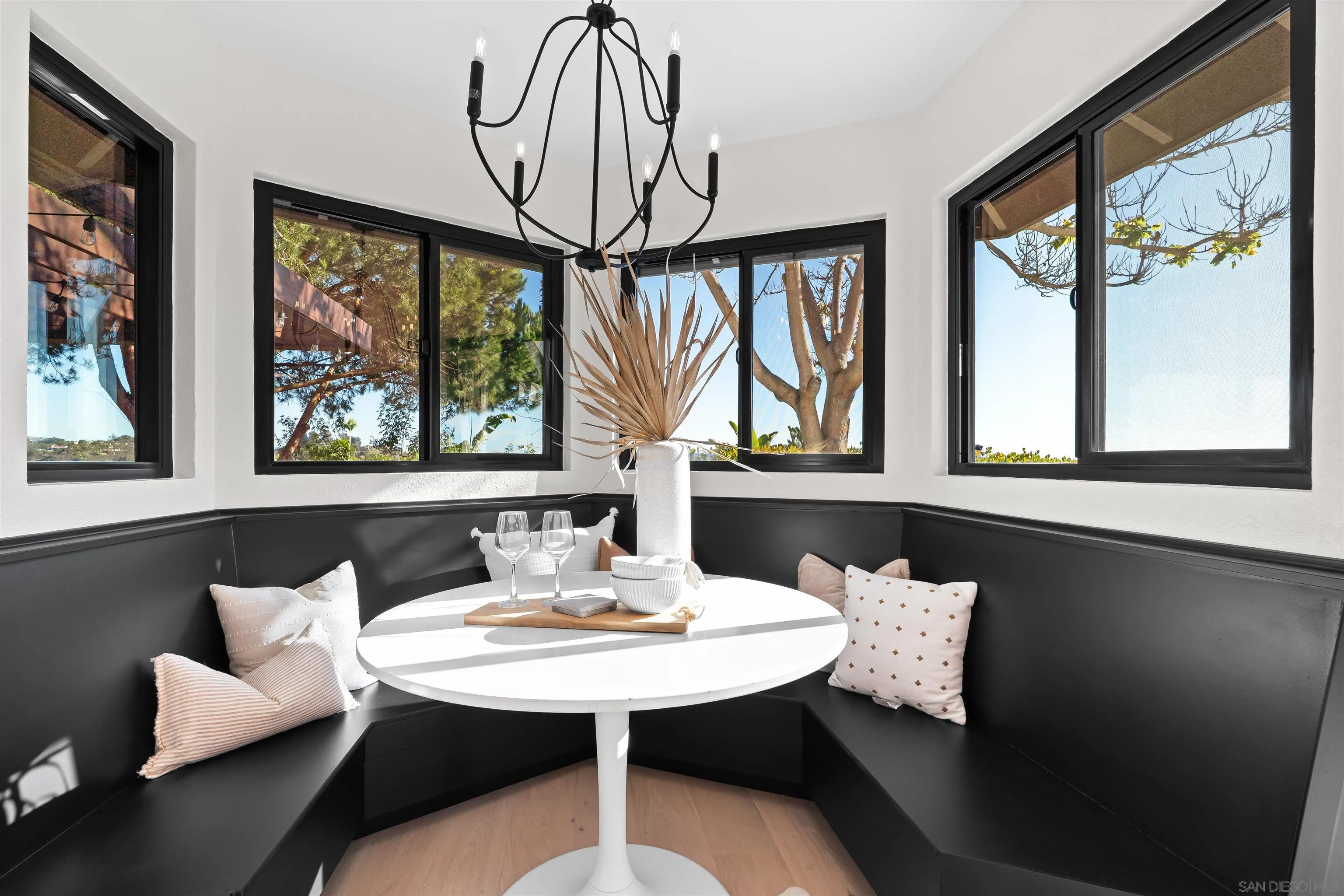 1170 Rancho Encinitas Drive Encinitas, CA 92024 - Photo 18 of 72 a view of a dining room with furniture a large window and a chandelier