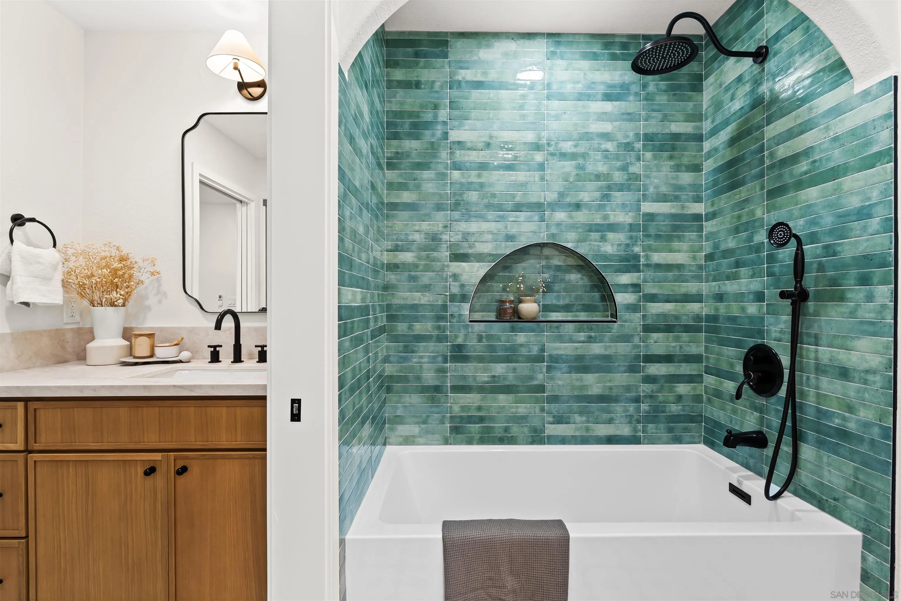 1170 Rancho Encinitas Drive Encinitas, CA 92024 - Photo 43 of 72 a bathroom with a sink a mirror and shower