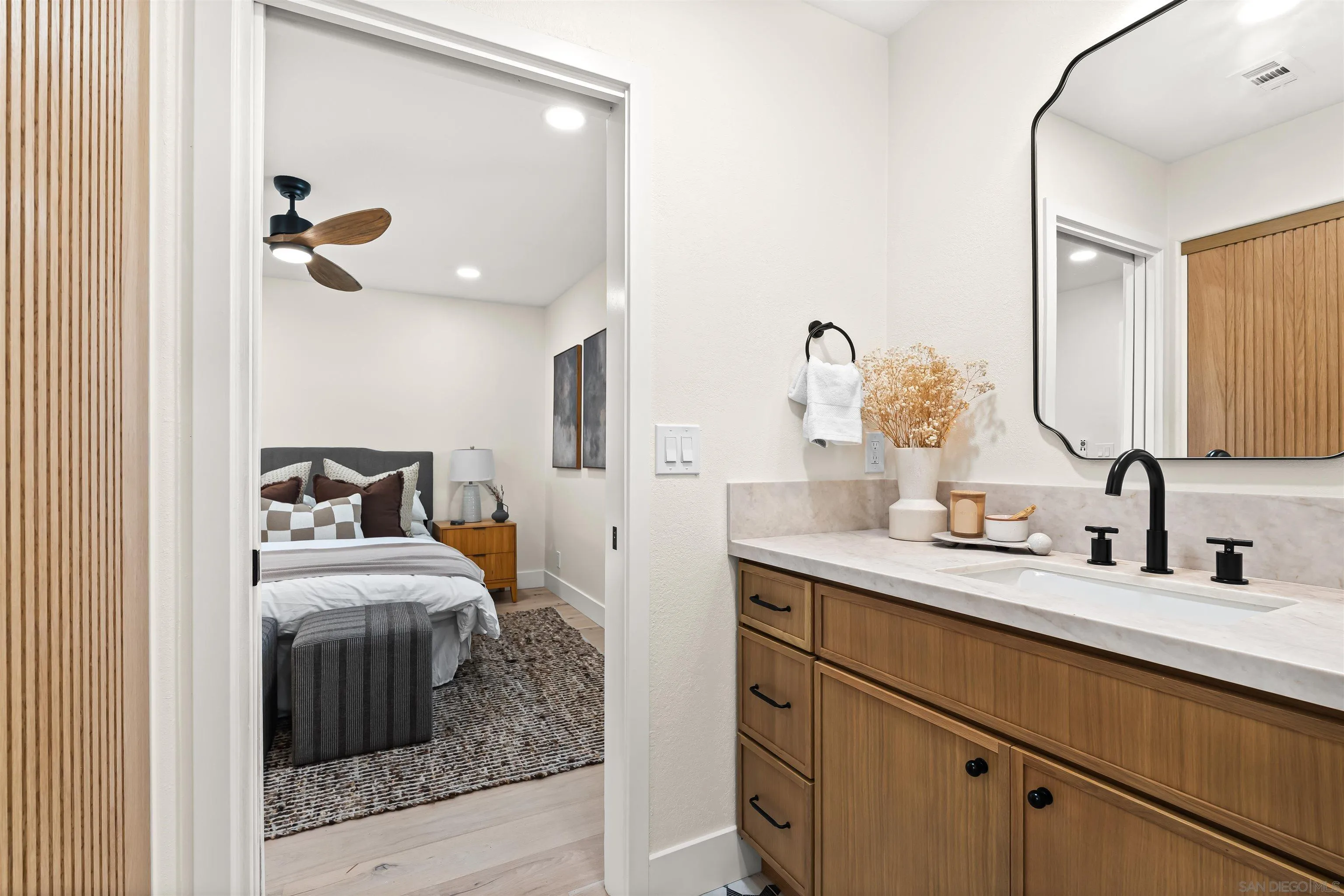 1170 Rancho Encinitas Drive Encinitas, CA 92024 - Photo 50 of 72 a en suite bathroom with a double vanity sink and a mirror