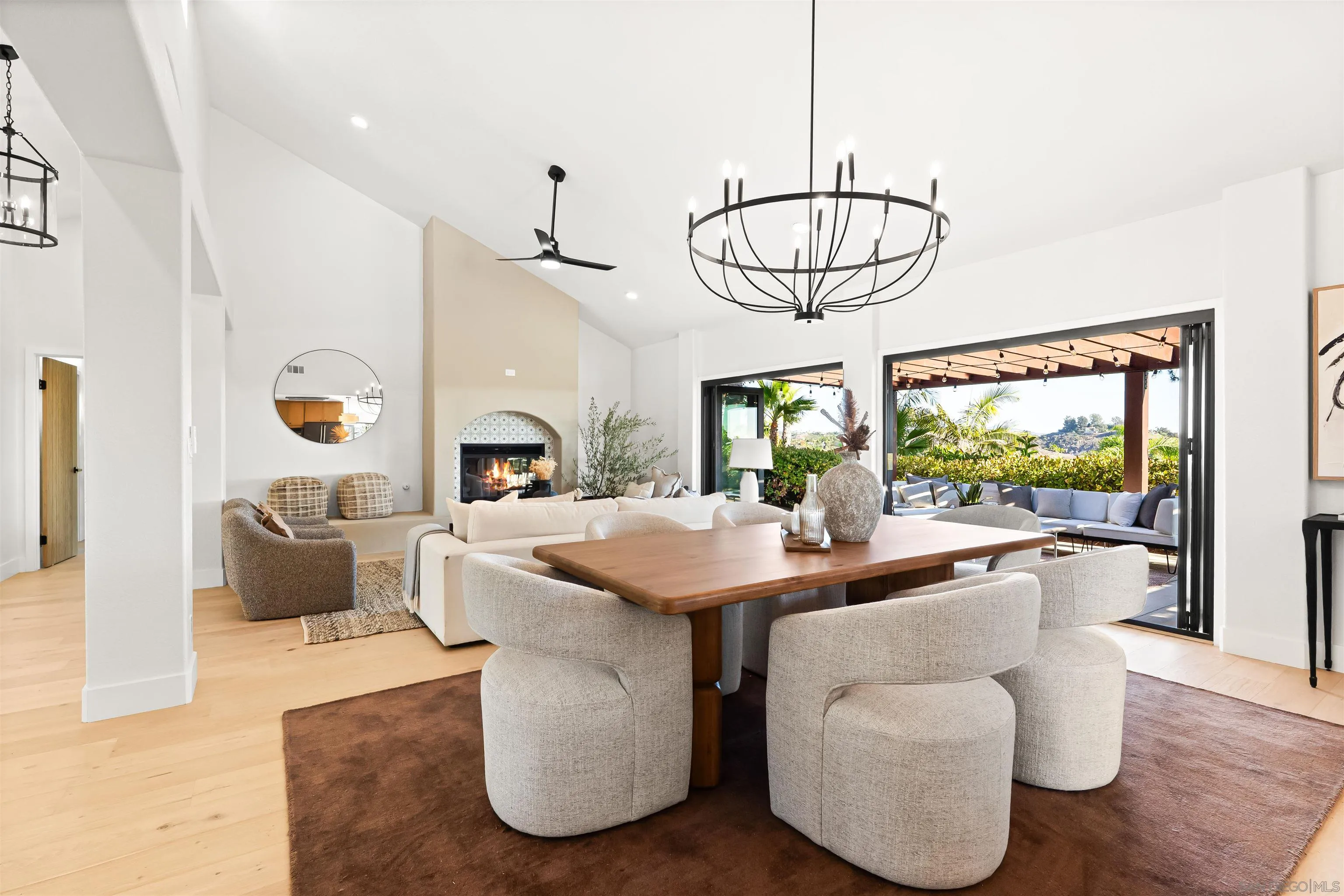 1170 Rancho Encinitas Drive Encinitas, CA 92024 - Photo 8 of 72 a dining room with furniture a chandelier and wooden floor