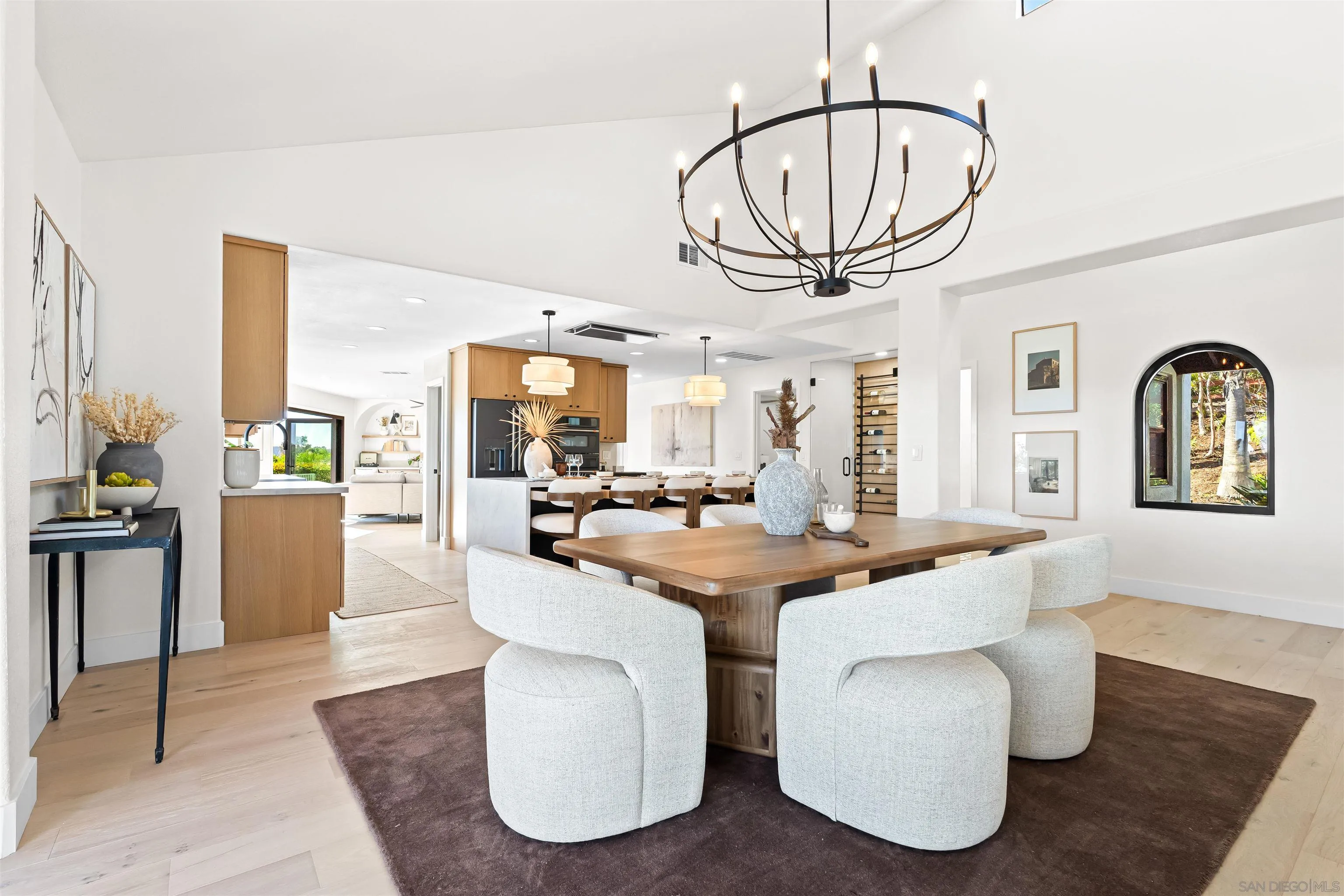 1170 Rancho Encinitas Drive Encinitas, CA 92024 - Photo 9 of 72 a dining room with furniture a rug and a chandelier
