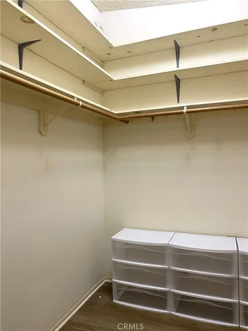 a view of room with racks on the wall