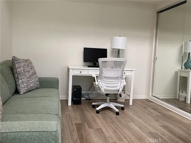 a view of a livingroom with furniture and a couch