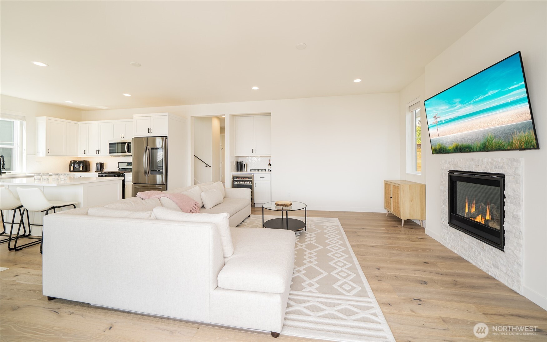 259 Bobcat Lane Chelan, WA 98816 - Photo 11 of 40 a living room with furniture a flat screen tv and a fireplace