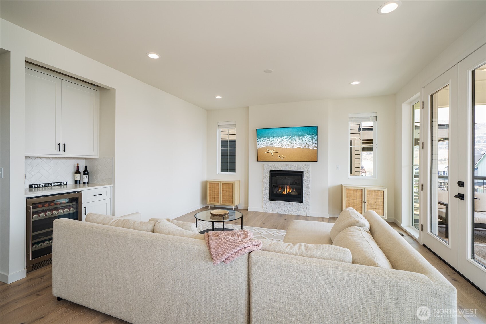 259 Bobcat Lane Chelan, WA 98816 - Photo 13 of 40 a living room with furniture a fireplace and a flat screen tv