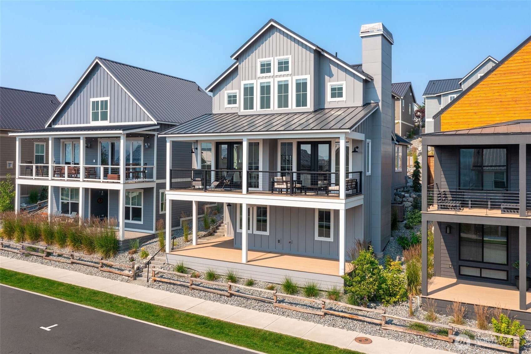 259 Bobcat Lane Chelan, WA 98816 - Photo 2 of 40 a front view of a house with a yard and potted plants