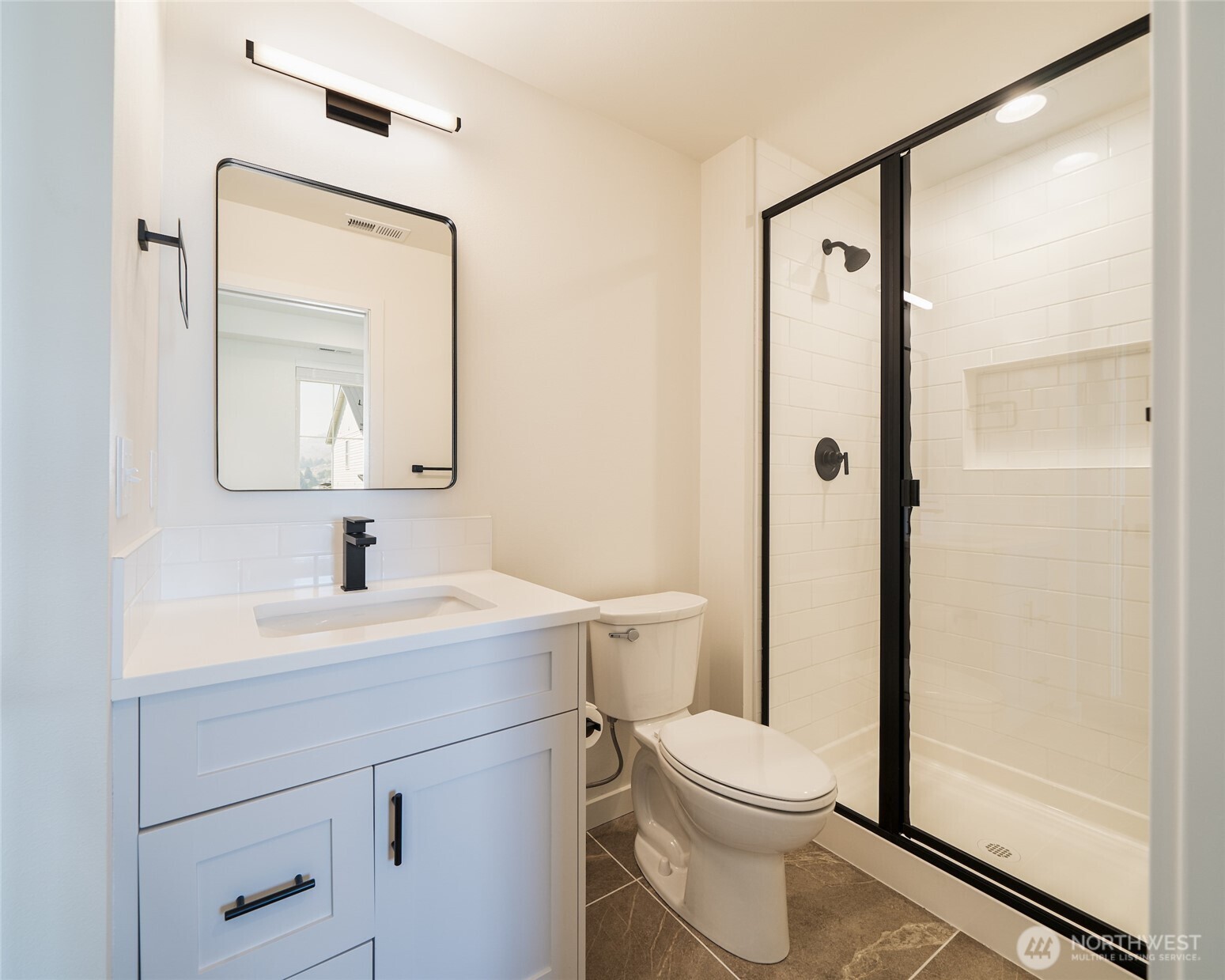 259 Bobcat Lane Chelan, WA 98816 - Photo 21 of 40 a bathroom with a toilet a sink and a mirror
