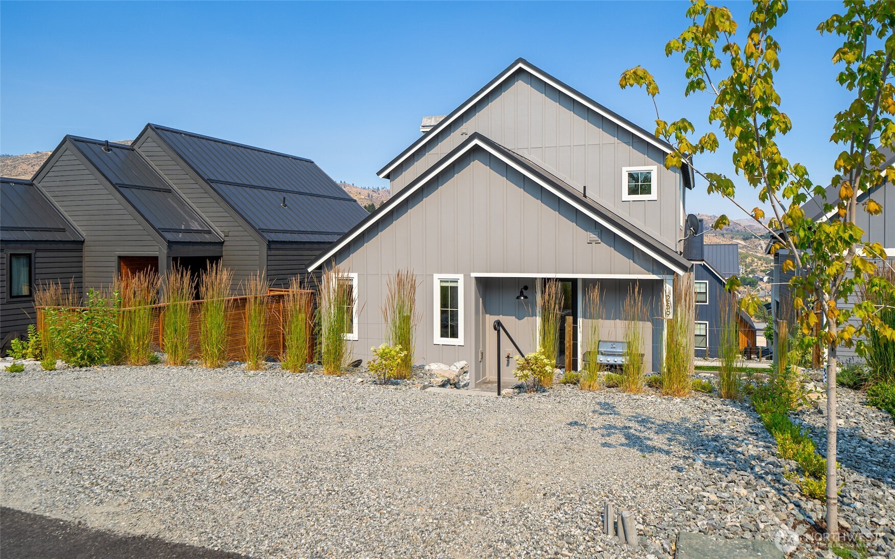 259 Bobcat Lane Chelan, WA 98816 - Photo 32 of 40 a front view of a house with garden
