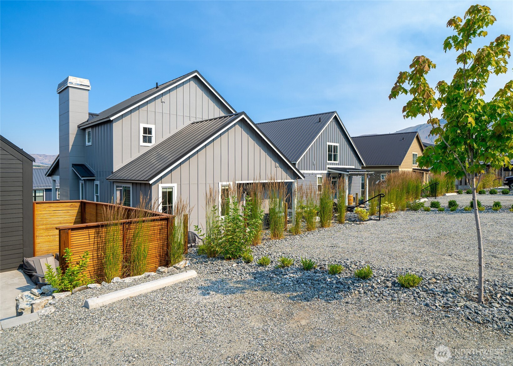 259 Bobcat Lane Chelan, WA 98816 - Photo 33 of 40 a front view of a house with a yard and garage