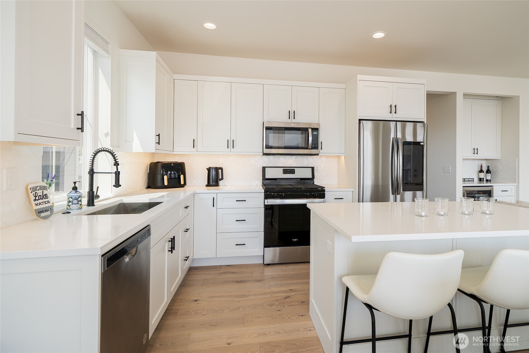 259 Bobcat Lane Chelan, WA 98816 - Photo 9 of 40 a kitchen with stainless steel appliances a stove refrigerator sink and cabinets