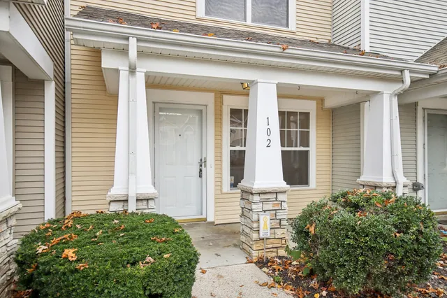 front view of a house with a small yard