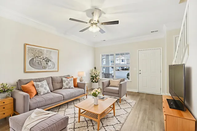 a living room with furniture and a flat screen tv