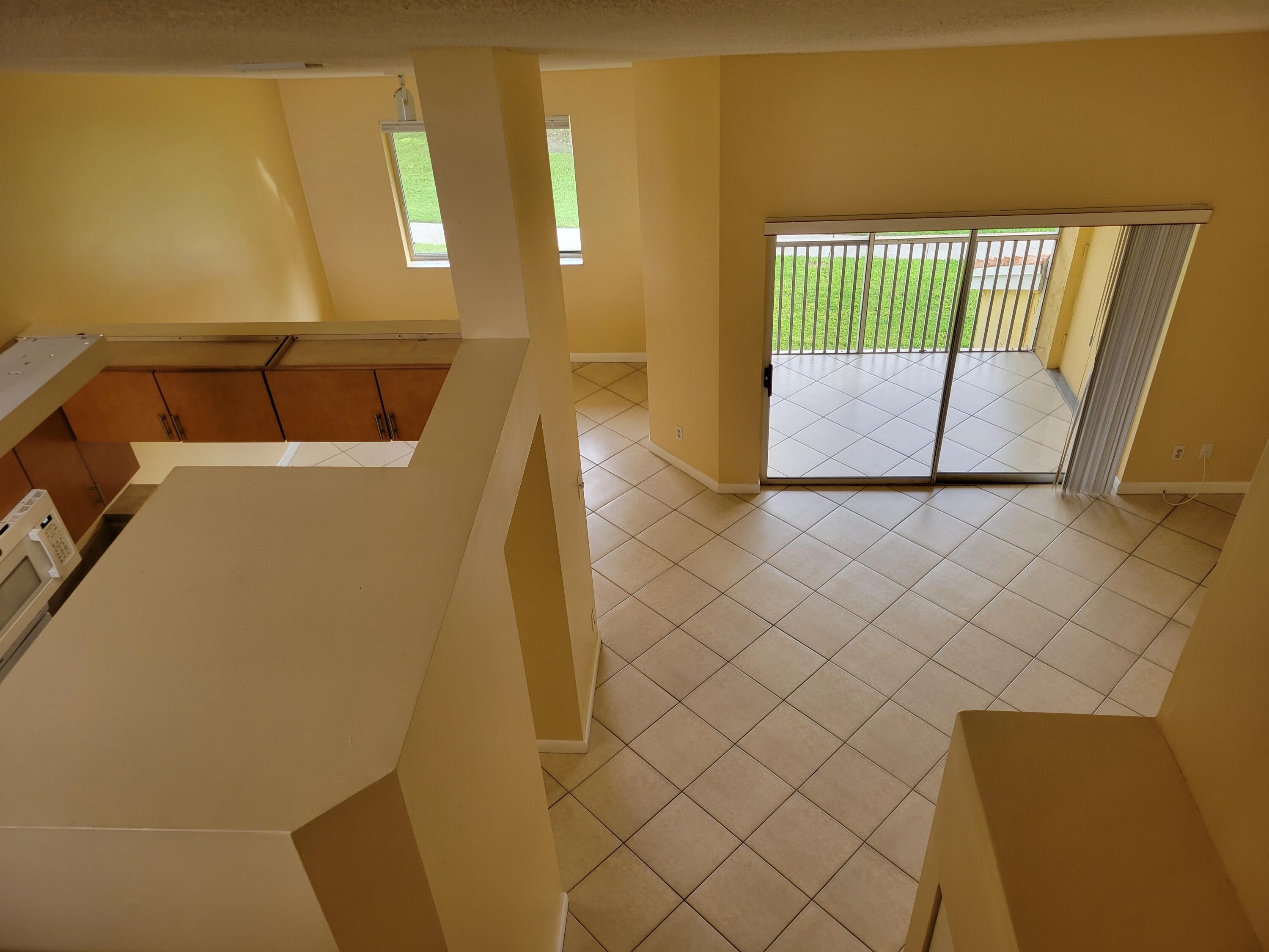 1112 Coral Club Drive, Unit 1112 Coral Springs, FL 33071 - Photo 12 of 16 a view of a bathroom with sink