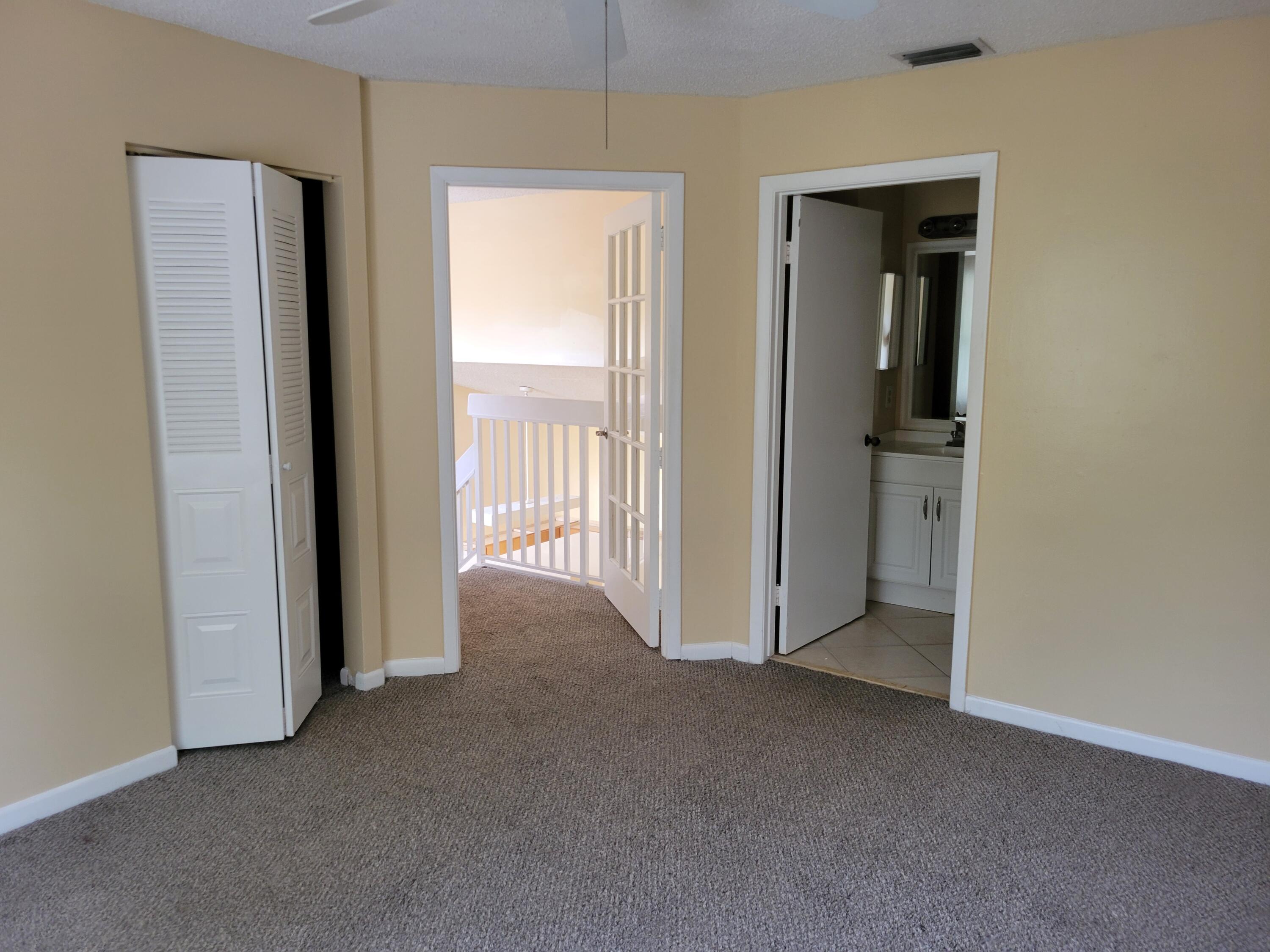1112 Coral Club Drive, Unit 1112 Coral Springs, FL 33071 - Photo 14 of 16 an empty room that has a large window