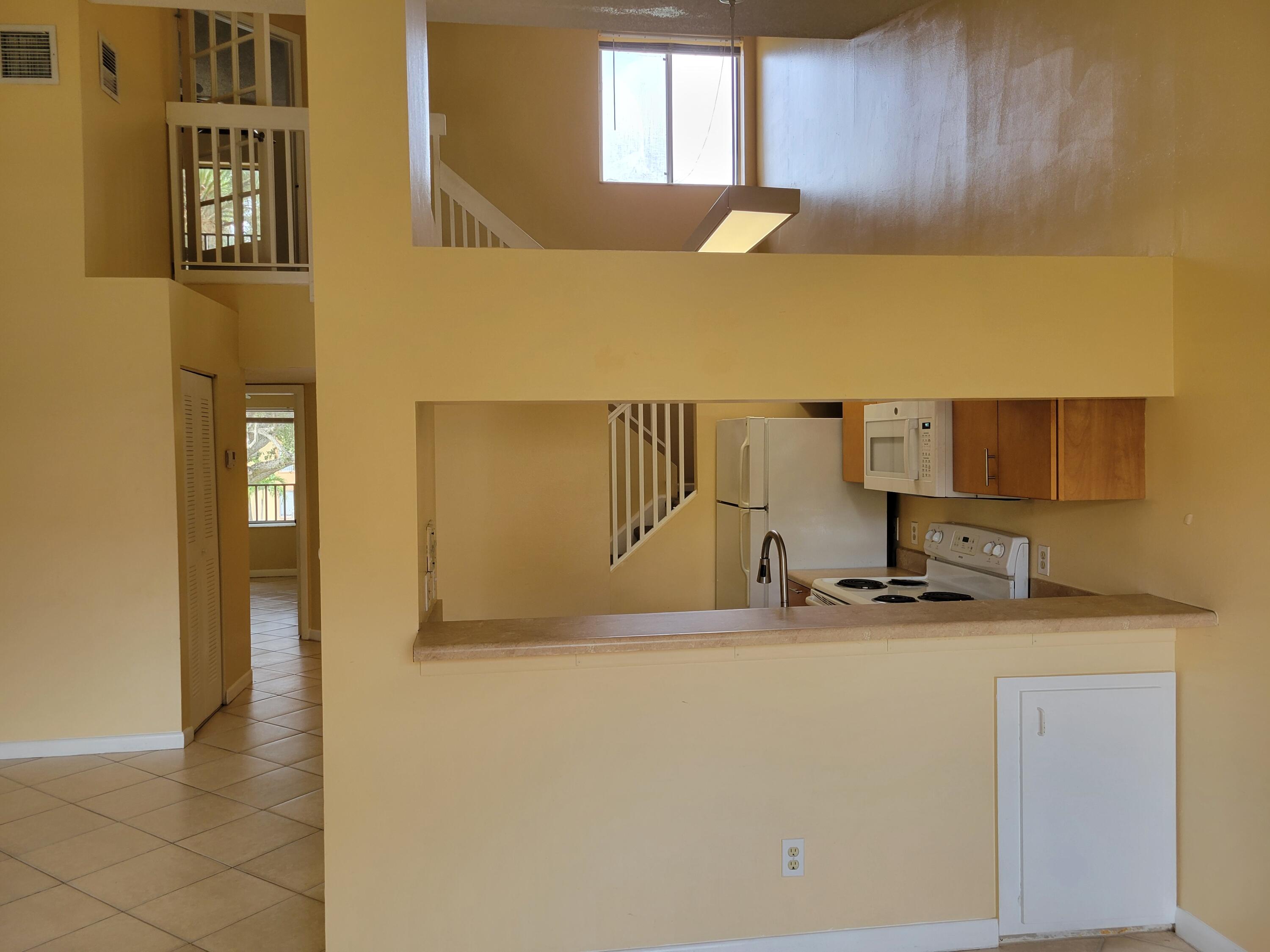 1112 Coral Club Drive, Unit 1112 Coral Springs, FL 33071 - Photo 4 of 16 a bathroom with a sink and a mirror