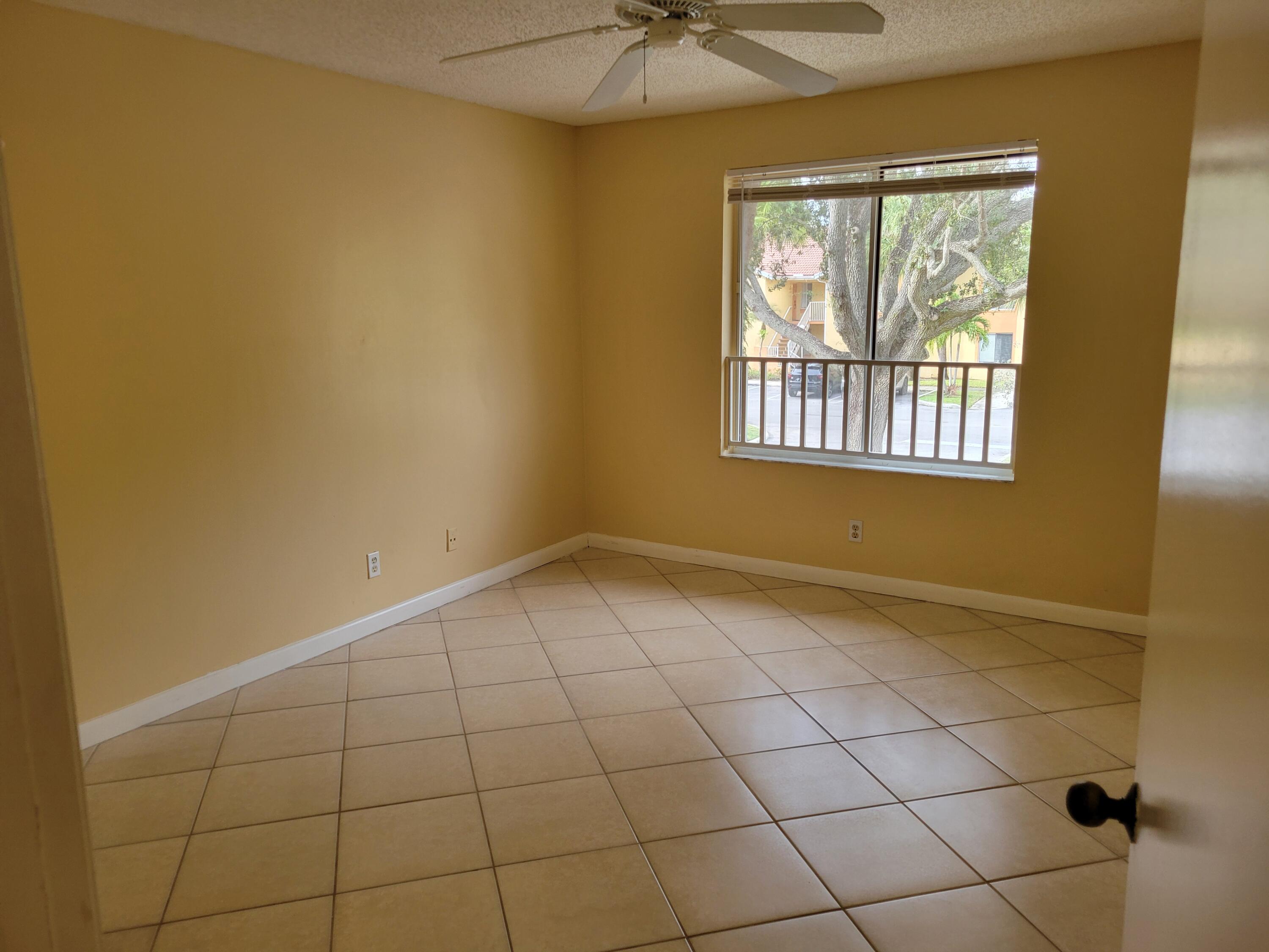 1112 Coral Club Drive, Unit 1112 Coral Springs, FL 33071 - Photo 8 of 16 a view of an empty room with a window