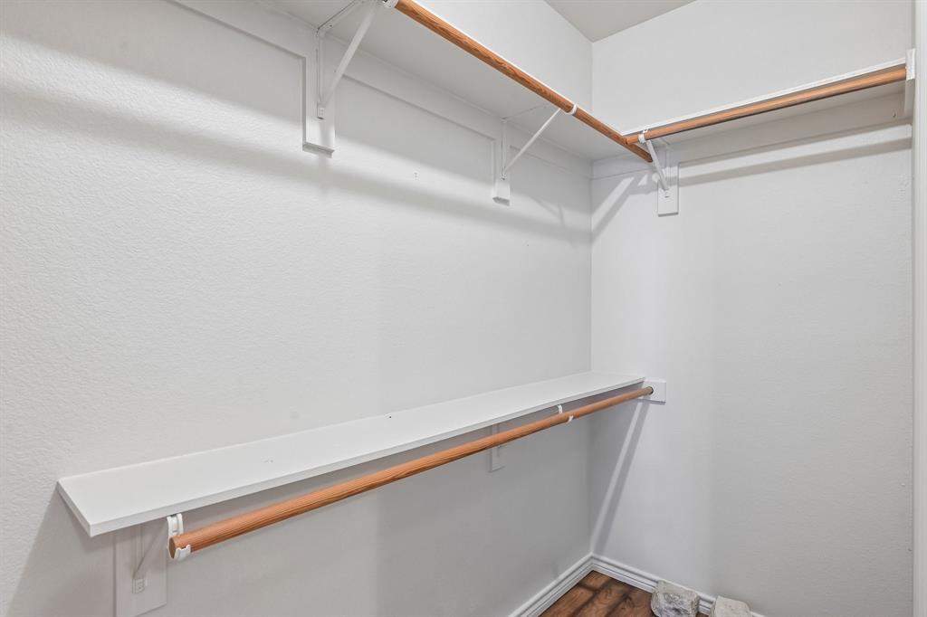 2617 Kirby Road Rowlett, TX 75088 - Photo 17 of 35 Walk-in closet featuring white shelving and wood-finish hanging rods