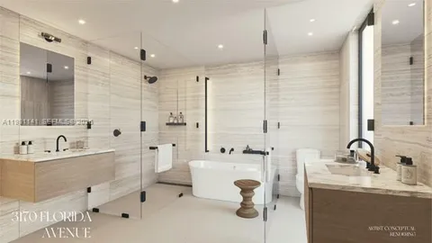 a bathroom with a double vanity sink mirror and bathtub