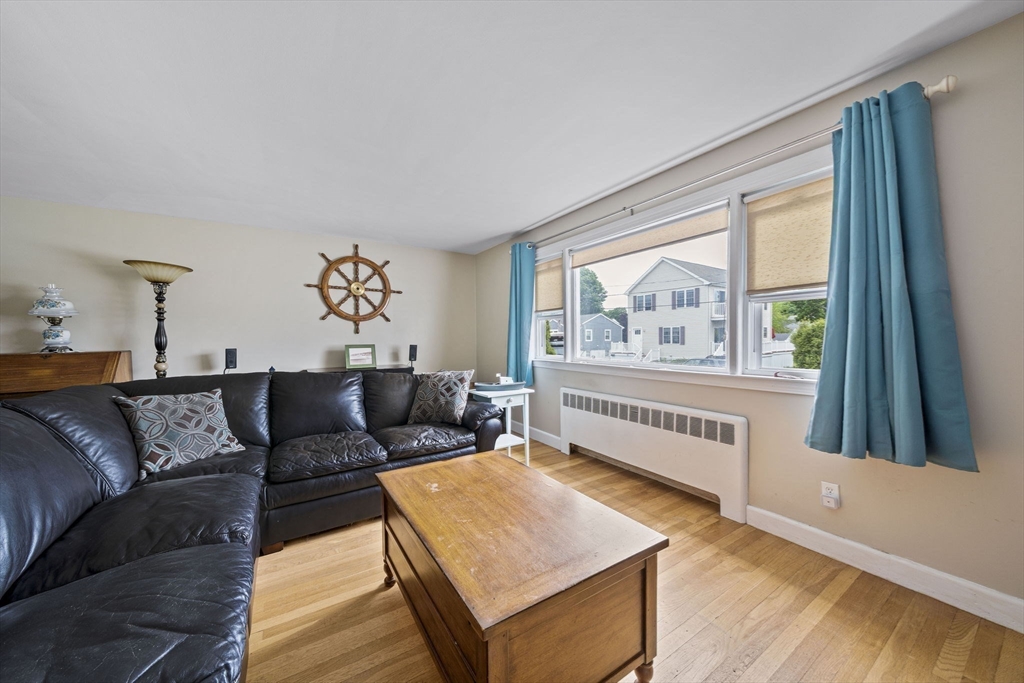 15 D Street Hull, MA 02045 - Photo 37 of 42 a living room with furniture and a large window