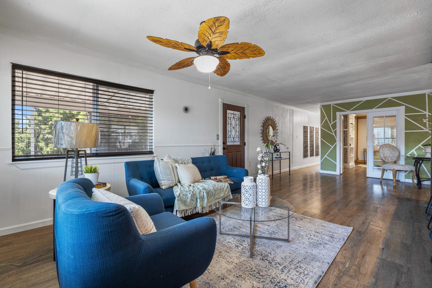 2621 Prescott Road, Unit 79 Modesto, CA 95350 - Photo 11 of 41 a living room with furniture wooden floor and a large window