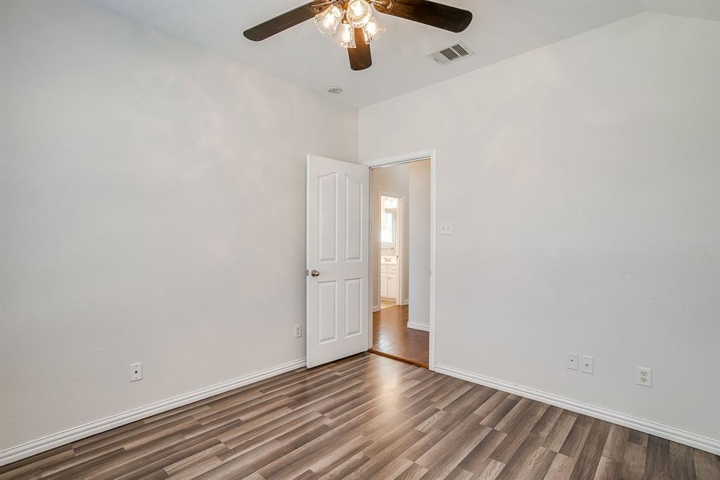 209 Cooperstown Drive Springtown, TX 76082 - Photo 27 of 40 Unfurnished room featuring wood finished floors and ceiling fan